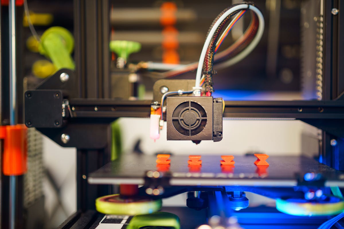 3D printer extruding a fidget mid-print